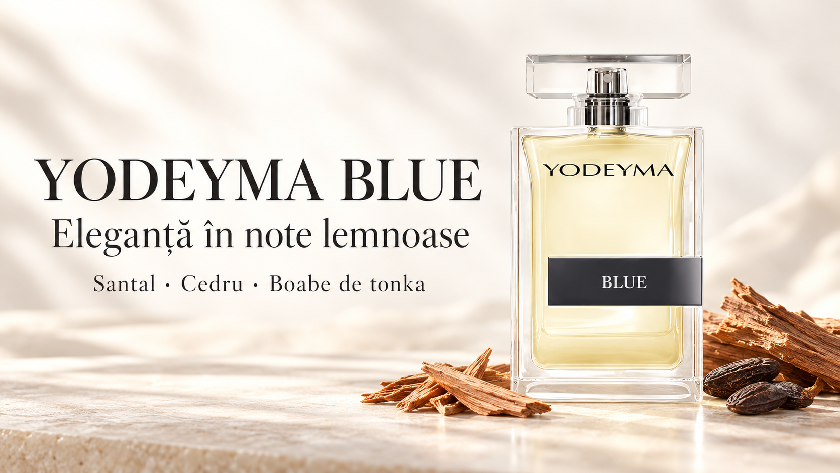 Flacon Yodeyma Blue alături de bucăți de lemn și boabe de tonka, pe fundal ivory luminos.