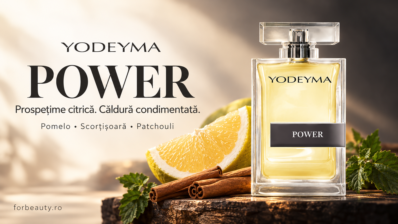 Flacon Yodeyma Power alături de pomelo, scorțișoară și frunze verzi, pe un fundal cald.